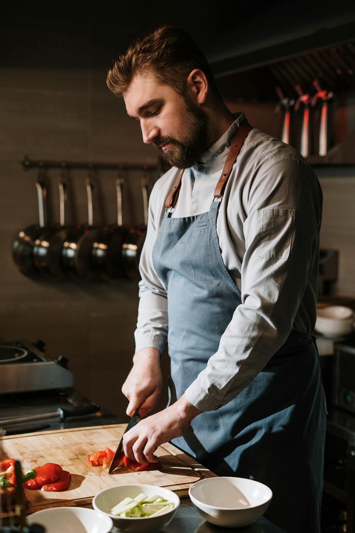 A chef preparing ingredients in a bright kitchen